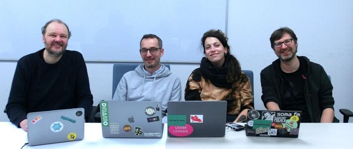 The crew of Homebrew Website Club Nuremberg 2024-05-08. 4 people with laptops sitting at a conference table in the Fab Lab Nuremberg.