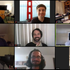 9 smiling faces in a Zoom meeting grid.